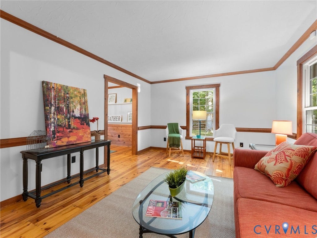 3801 Old River Trail, Powhatan, VA 23139 Interior space featuring wood-finish flooring, natural wood crown molding, chair rail trim, and window casing