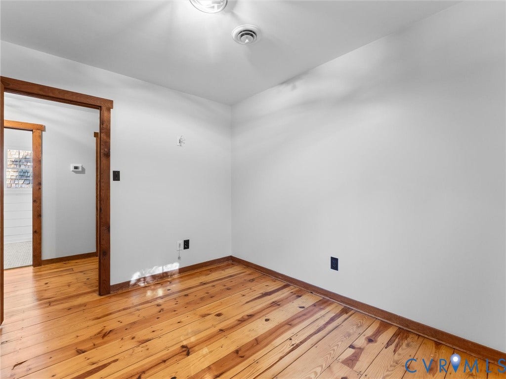 3801 Old River Trail, Powhatan, VA 23139 Wood-finish flooring, natural wood door casing, and neutral wall paint