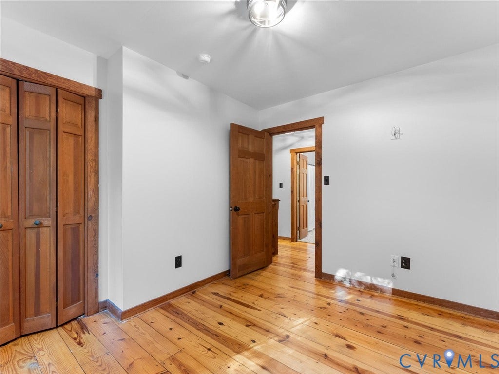 3801 Old River Trail, Powhatan, VA 23139 Interior space featuring wood-finish flooring, natural wood doors, and matching wood door casings
