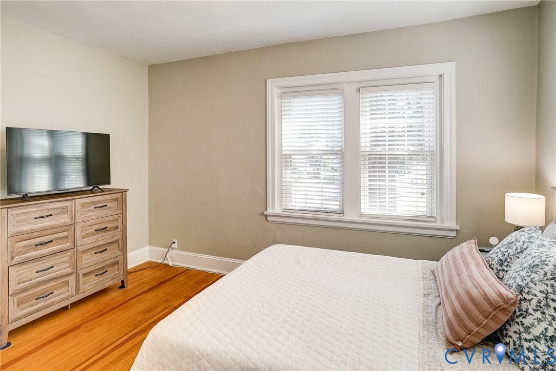 Hardwood flooring, dual windows, and crown molding