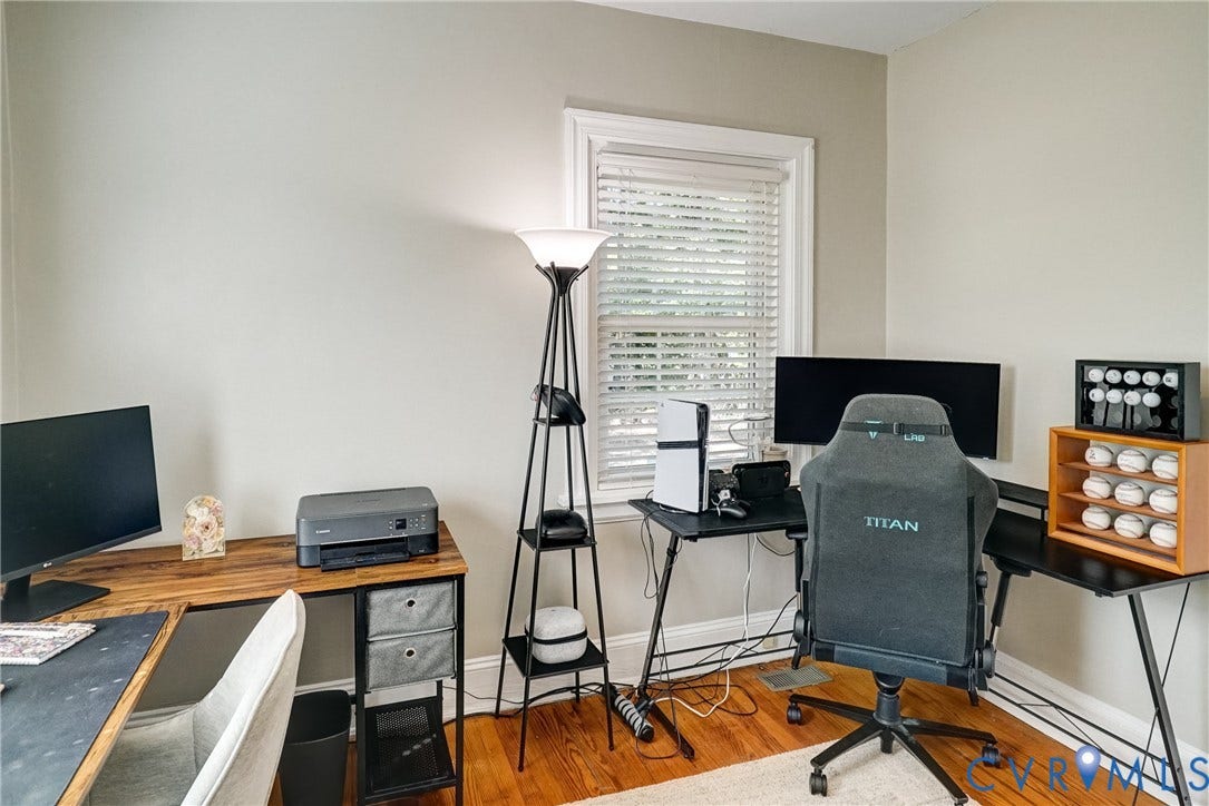 Bedroom 2, Hardwood flooring, light-toned wall paint, a window with horizontal blinds, and white trim
