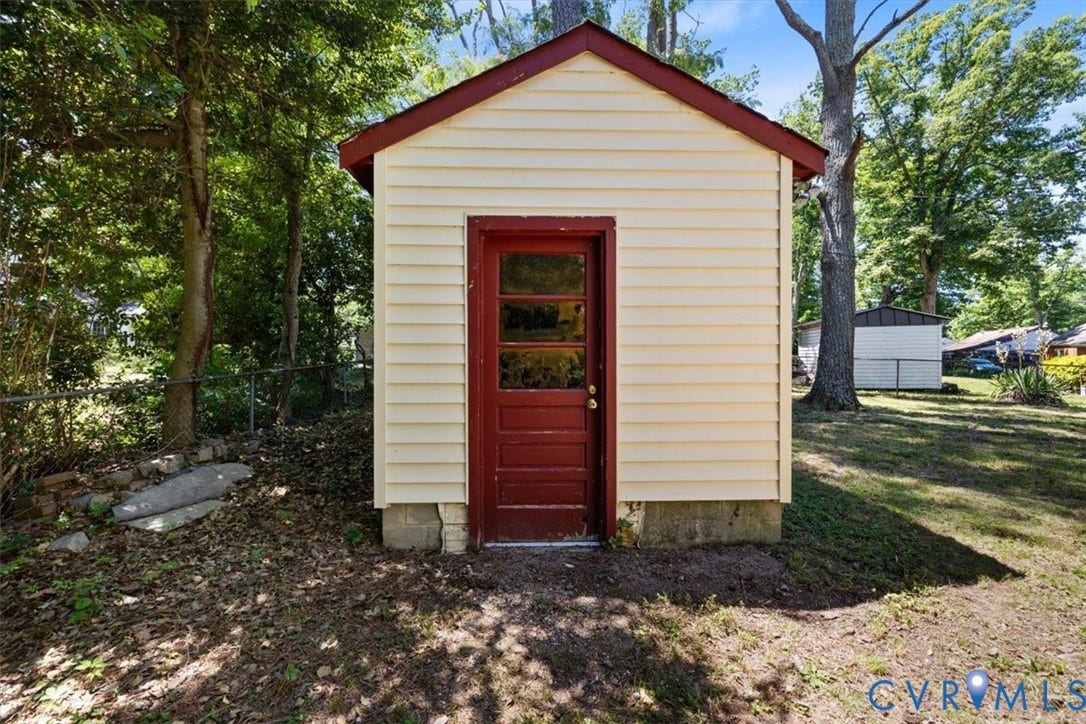 1215 Starling Drive, Henrico, VA 23229 Shed with horizontal siding and a gabled roof
