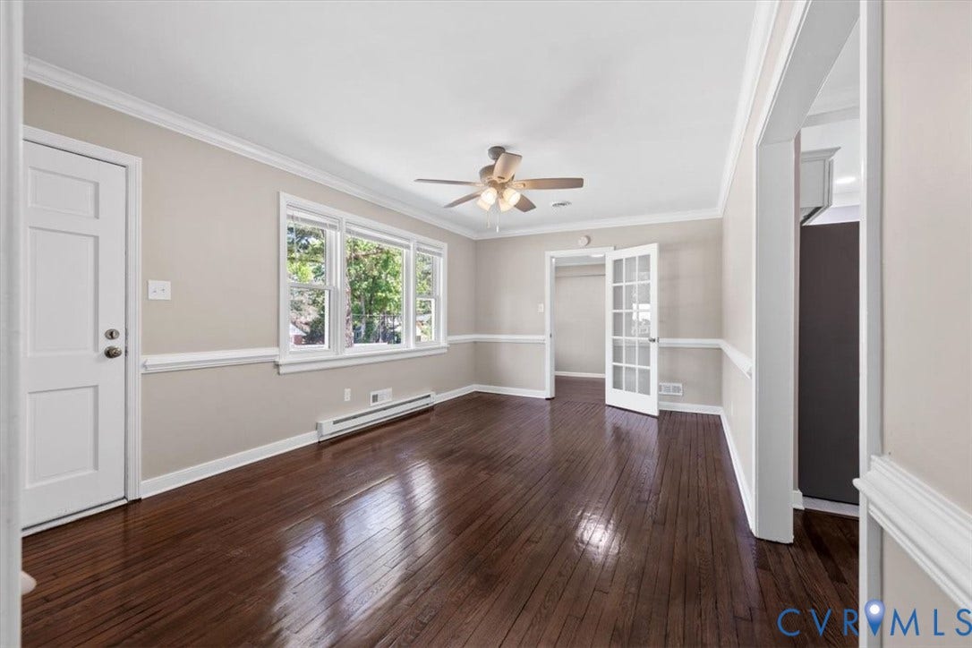 1215 Starling Drive, Henrico, VA 23229 Hardwood flooring, multi-pane windows, crown molding, chair rail molding, and a ceiling fan with integrated lighting