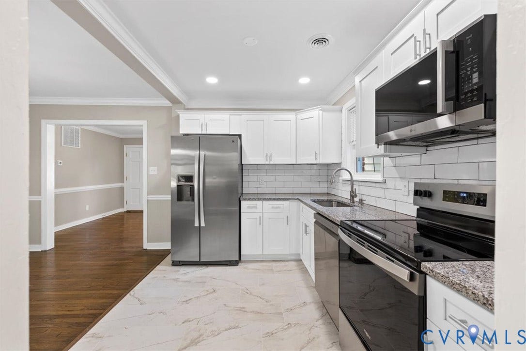 1215 Starling Drive, Henrico, VA 23229 White shaker cabinetry with stainless steel appliances, granite countertops, subway tile backsplash, and recessed lighting