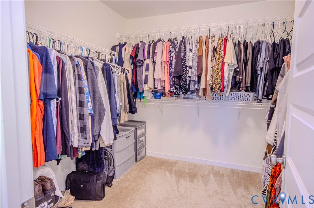 Walk-in primary bedroom closet