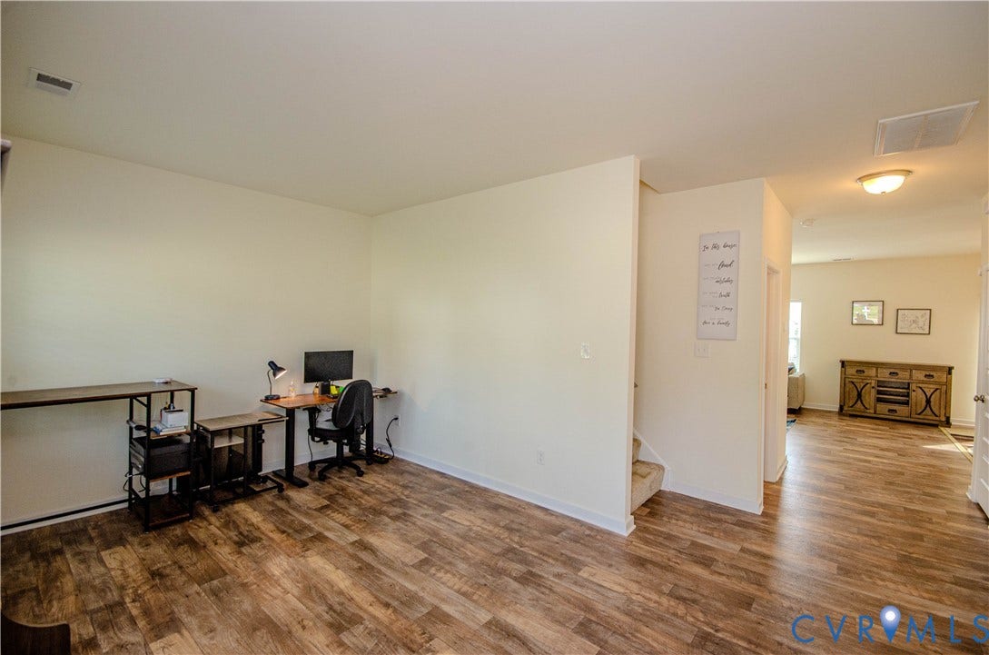 Upon entering, you are greeted by the expansive foyer/office space, vinyl flooring and neutral paint palette