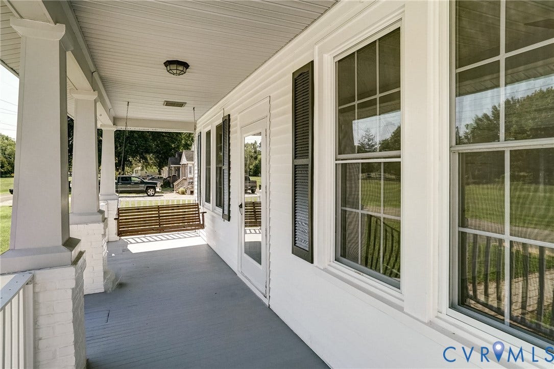 10024 Washington Road, Richmond, VA 23060 Spacious covered porch with painted wood flooring and white support columns