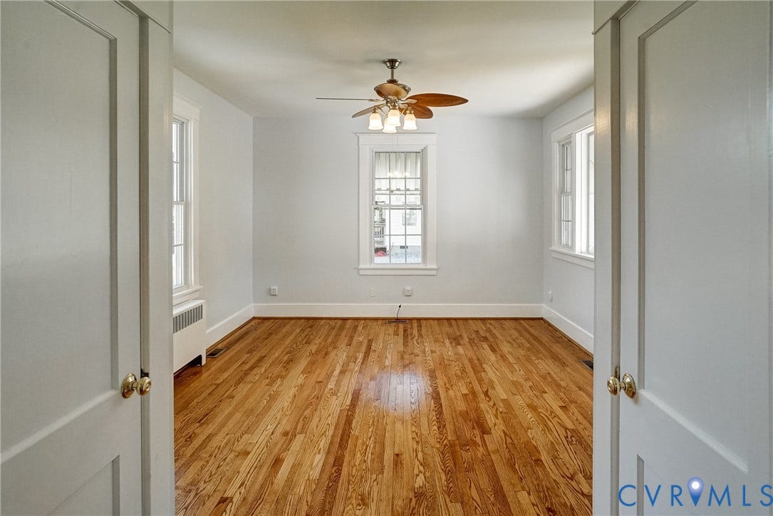 10024 Washington Road, Richmond, VA 23060 Hardwood flooring throughout, multiple windows, ceiling fan with integrated lighting, and white trim