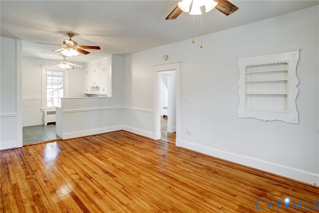 10024 Washington Road, Richmond, VA 23060 Hardwood flooring, painted white walls, built-in shelving, white trim work, and ceiling fans
