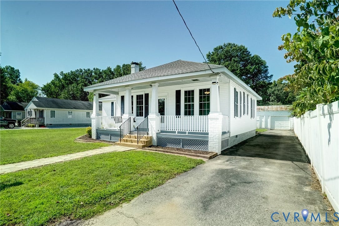 10024 Washington Road, Richmond, VA 23060 White siding exterior with a covered porch and railing