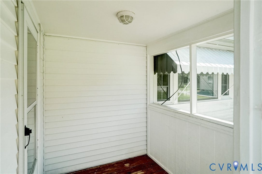 10024 Washington Road, Richmond, VA 23060 porch with white siding, screened windows, and an overhead light fixture