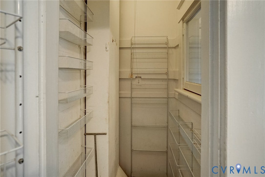 10024 Washington Road, Richmond, VA 23060 Built-in wire shelving, window, and white walls