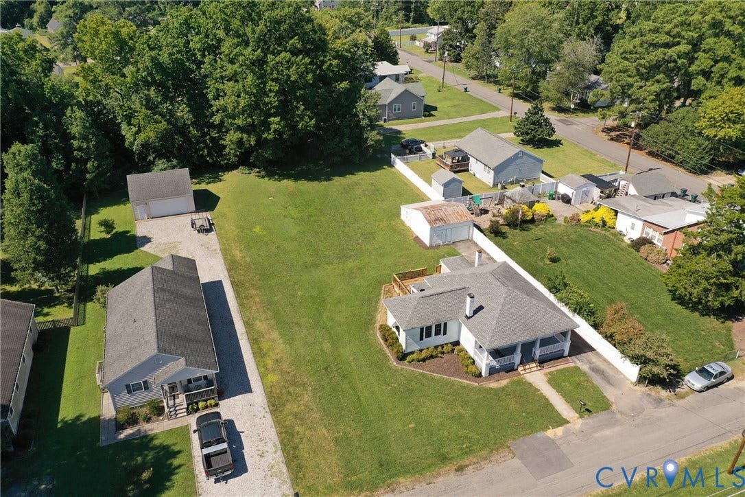 10024 Washington Road, Richmond, VA 23060 Expansive lot featuring two distinct dwellings, mature trees, a detached garage, and an additional shed