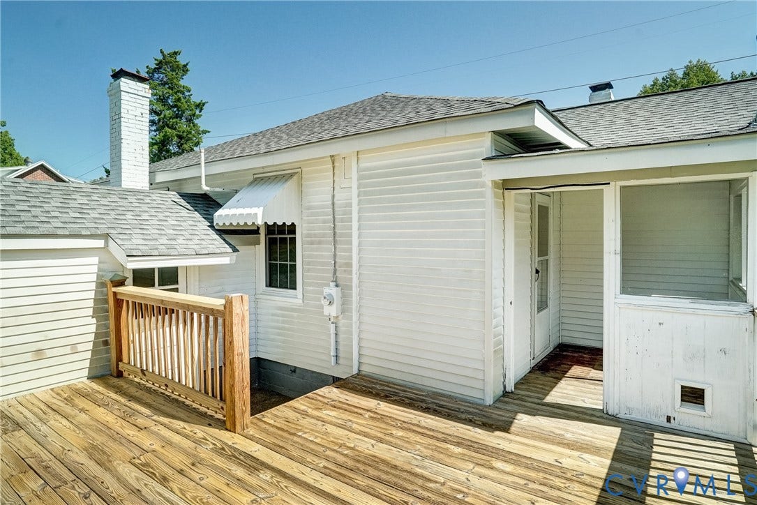 10024 Washington Road, Richmond, VA 23060 Wood-finish deck with a natural wood railing, white siding, and a screened porch