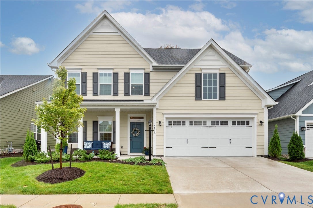 4837 Bacova Village Trail, Glen Allen, VA 23059 Two-story residence featuring light-colored siding, a two-car garage, and a covered front porch with columns