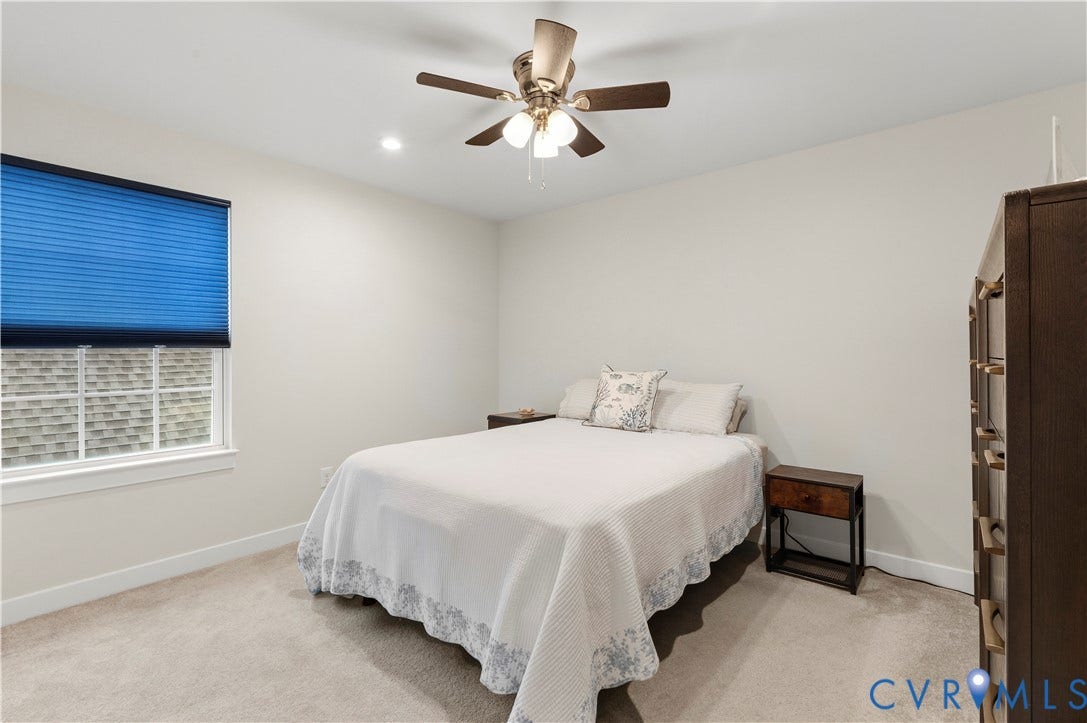 4837 Bacova Village Trail, Glen Allen, VA 23059 Recessed lighting, ceiling fan with light kit, window with blue cellular shade, and neutral carpeting