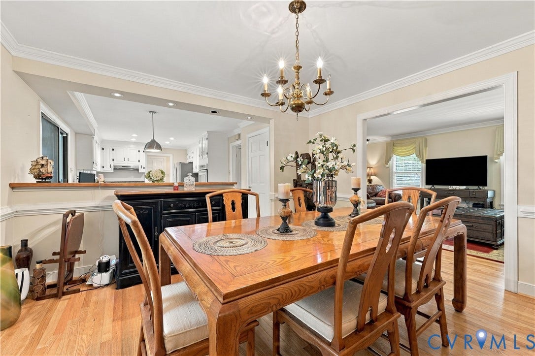 8307 Wallingford Lane, Chickahominy Bluffs, Henrico, VA 23227 Hardwood flooring, crown molding, chair rail detailing, recessed lighting, and a brass chandelier