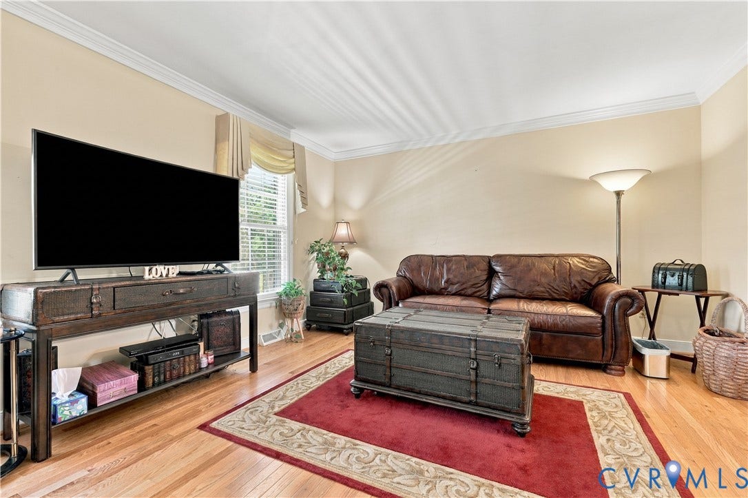 8307 Wallingford Lane, Chickahominy Bluffs, Henrico, VA 23227 Hardwood flooring, crown molding, double-pane window, and neutral wall tones