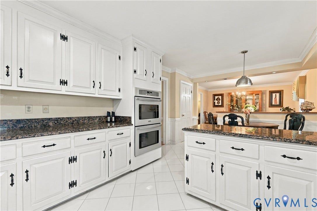 8307 Wallingford Lane, Chickahominy Bluffs, Henrico, VA 23227 White cabinetry with dark-finish hardware, granite countertops, double wall ovens, a kitchen island, and tile flooring
