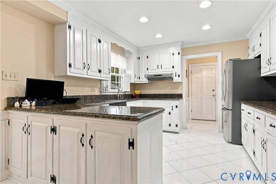 8307 Wallingford Lane, Chickahominy Bluffs, Henrico, VA 23227 Kitchen featuring white paneled cabinetry, dark countertops, a stainless steel refrigerator, recessed lighting, and white tile flooring