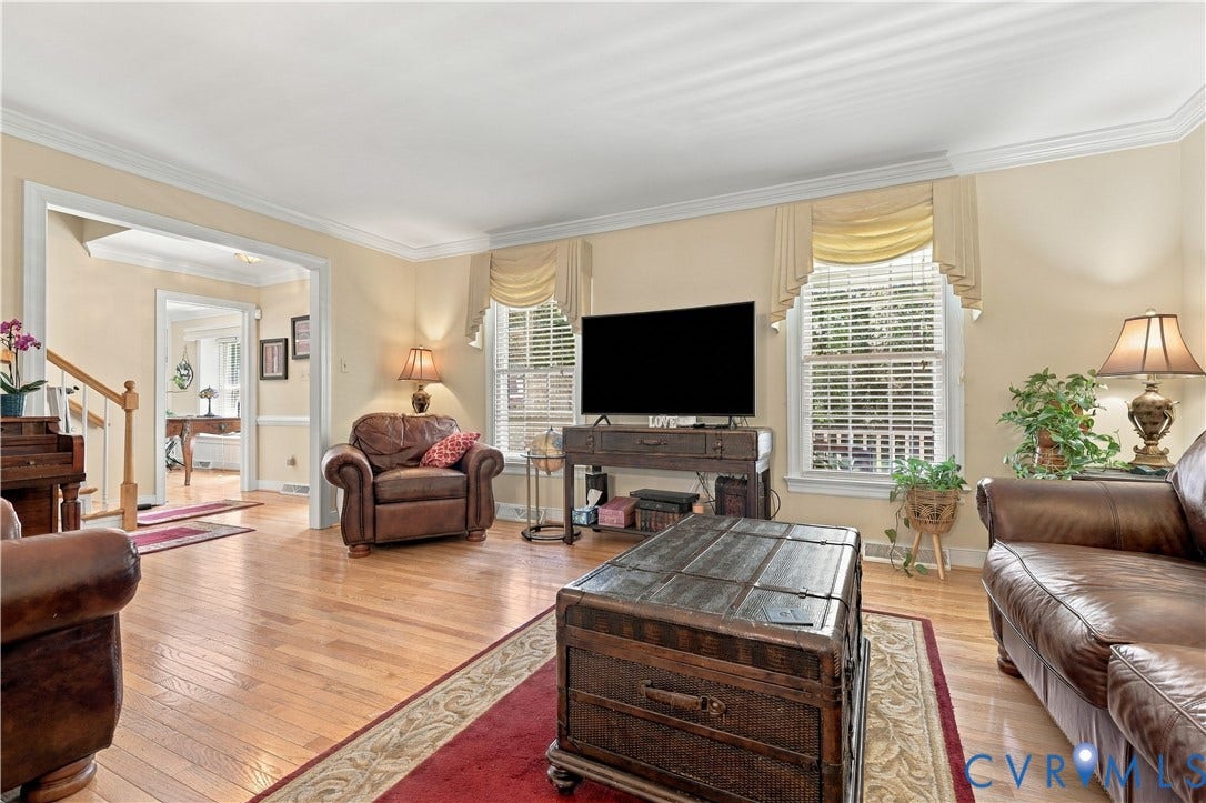 8307 Wallingford Lane, Chickahominy Bluffs, Henrico, VA 23227 Hardwood flooring throughout, crown molding, double windows with blinds, and white trim accents