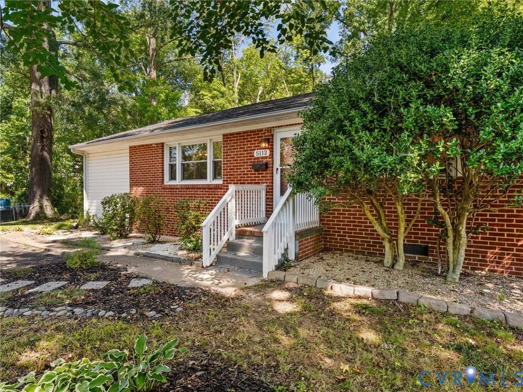 5112 Bethlehem Road, Libbie Mill Area, Richmond, VA 23230 Red brick exterior with white siding, concrete steps, white railings, and mature trees