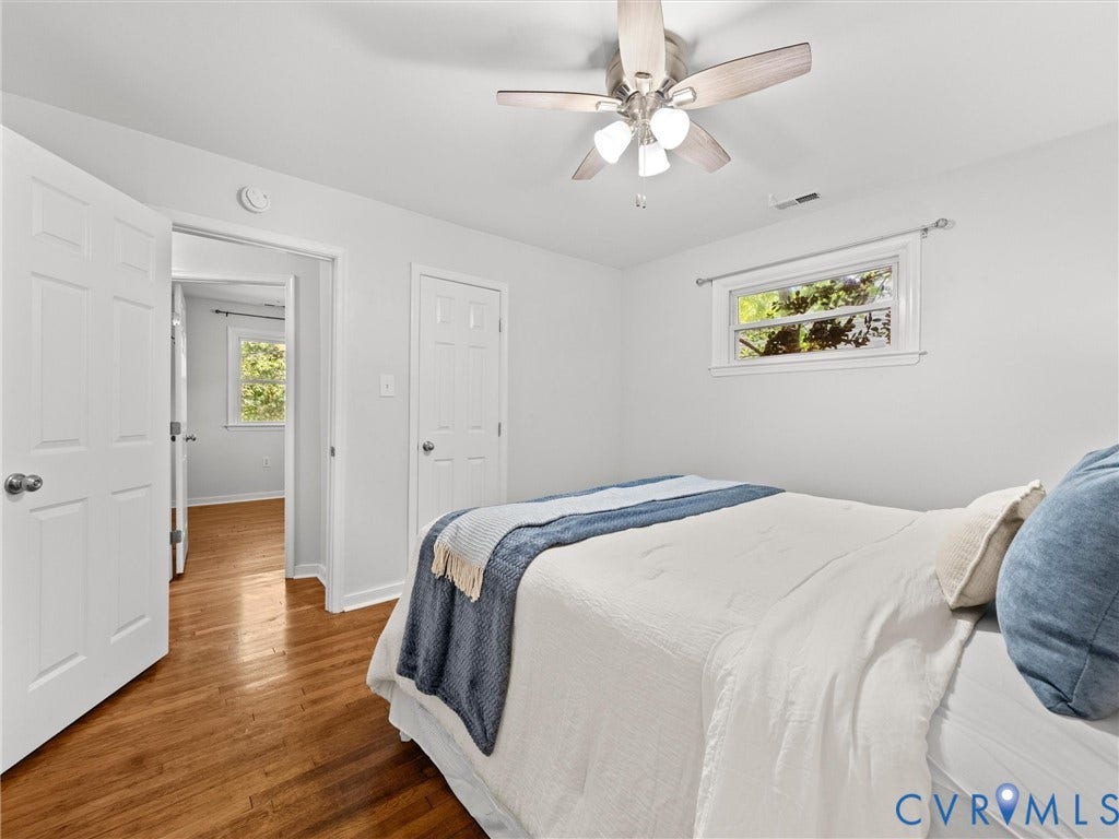 5112 Bethlehem Road, Libbie Mill Area, Richmond, VA 23230 Hardwood-finish flooring, white paneled doors, ceiling fan with integrated lighting, and multiple windows