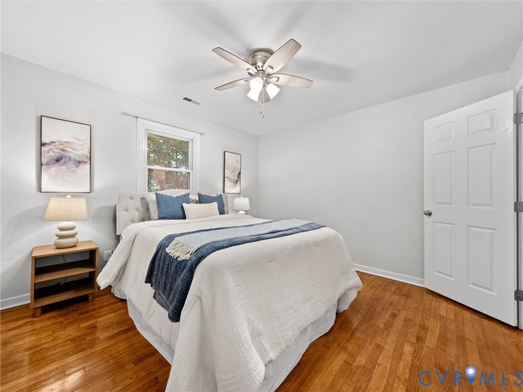 5112 Bethlehem Road, Libbie Mill Area, Richmond, VA 23230 Hardwood flooring, ceiling fan with integrated lighting, white paneled door, and a single window