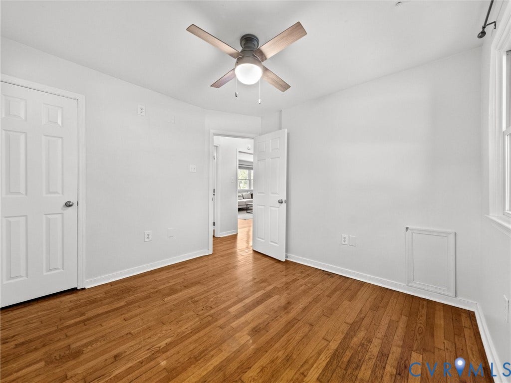 5112 Bethlehem Road, Libbie Mill Area, Richmond, VA 23230 Hardwood flooring, ceiling fan, white paneled doors, and white walls