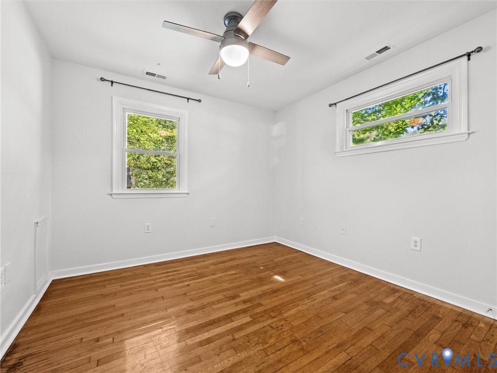 5112 Bethlehem Road, Libbie Mill Area, Richmond, VA 23230 Hardwood flooring and two large windows with white trim