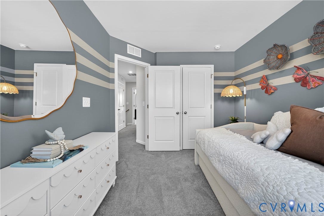 6126 Hull Street Road, Richmond, VA 23224 Plush carpet flooring, white paneled doors, and a built-in closet with double doors