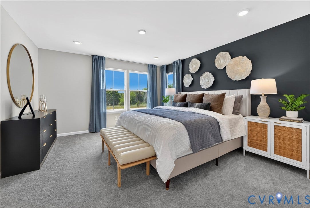 6126 Hull Street Road, Richmond, VA 23224 Recessed ceiling lighting, large windows, plush carpet flooring, a decorative accent wall, and a full-height paneled headboard