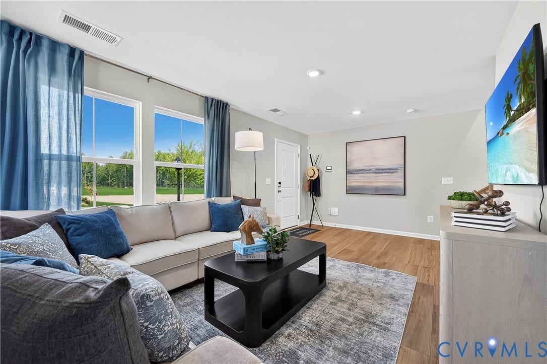 6126 Hull Street Road, Richmond, VA 23224 Wood-finish flooring throughout, recessed lighting, and a white entry door