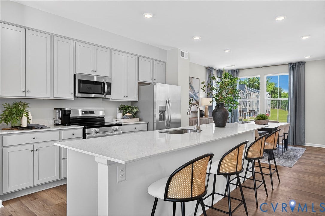 6126 Hull Street Road, Richmond, VA 23224 Light grey cabinetry with stainless steel appliances