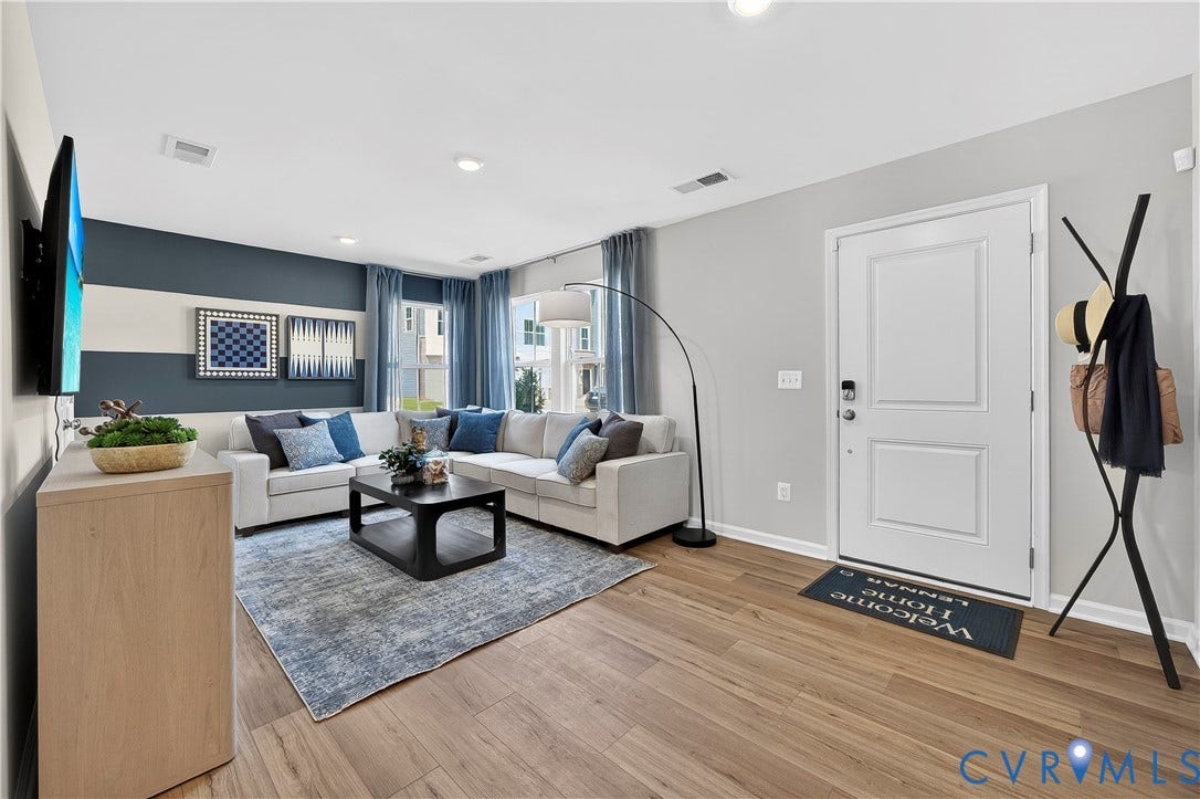 6126 Hull Street Road, Richmond, VA 23224 Wood-finish flooring, recessed lighting, and a paneled entry door