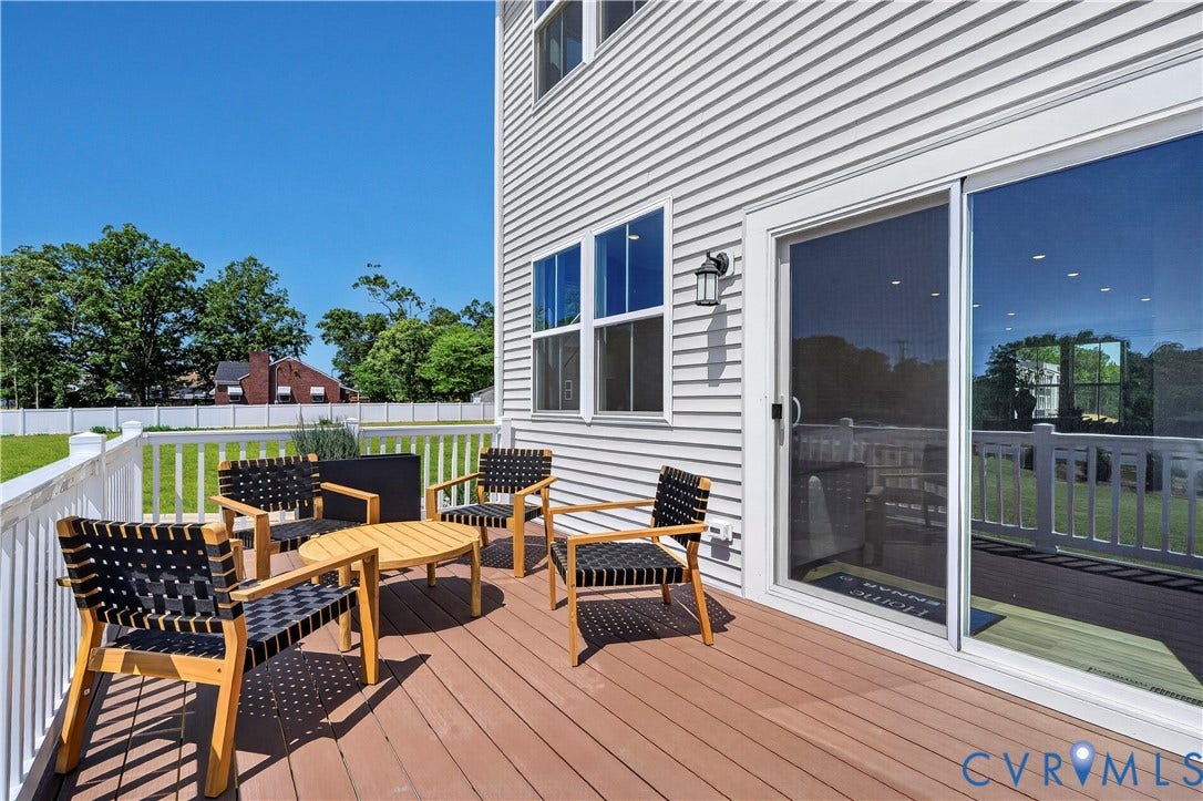 6126 Hull Street Road, Richmond, VA 23224 Exterior deck featuring composite wood-finish flooring, white railing, and a sliding glass door