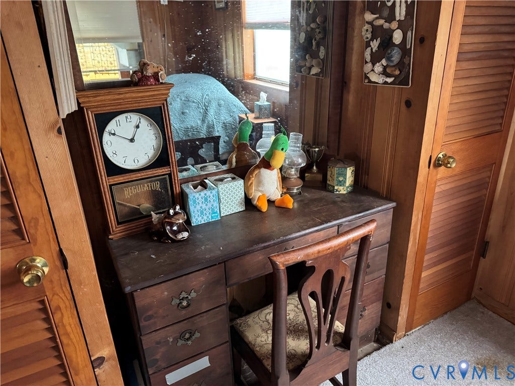 36 Beach Road, Reedville, VA 22539 Natural wood wall paneling and matching louvered wood closet doors