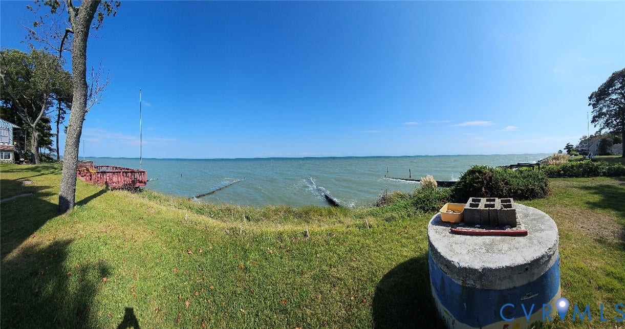 36 Beach Road, Reedville, VA 22539 Waterfront property featuring expansive grassy areas and a clear horizon