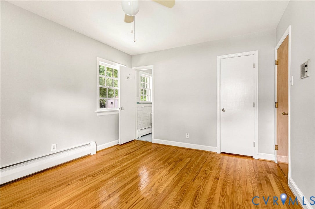 5215 Sprucewood Avenue, North Chesterfield, VA 23234 Wood-finish flooring, neutral wall tones, white trim, window with exterior views, and a ceiling fan