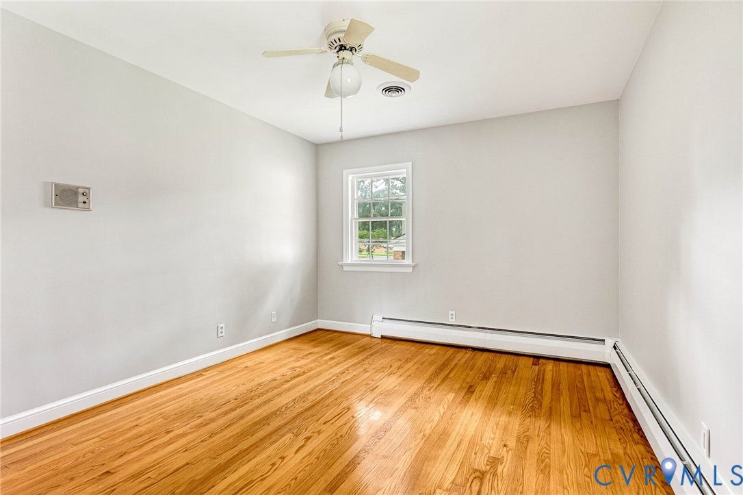 5215 Sprucewood Avenue, North Chesterfield, VA 23234 Hardwood flooring, central ceiling fan, and white trim molding