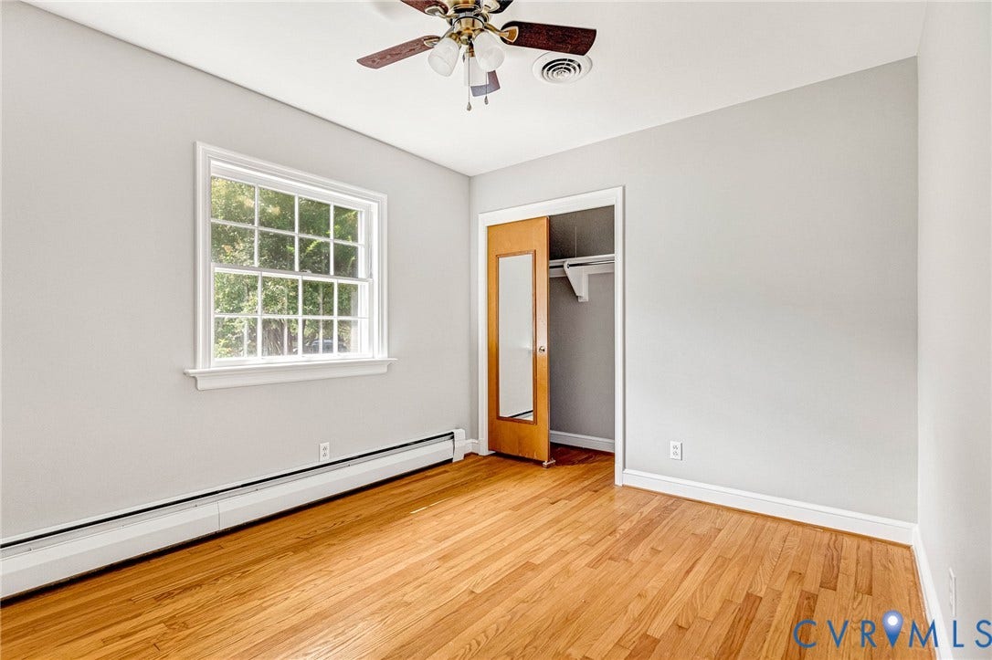 5215 Sprucewood Avenue, North Chesterfield, VA 23234 Hardwood flooring, white trim, ceiling fan, and a built-in closet
