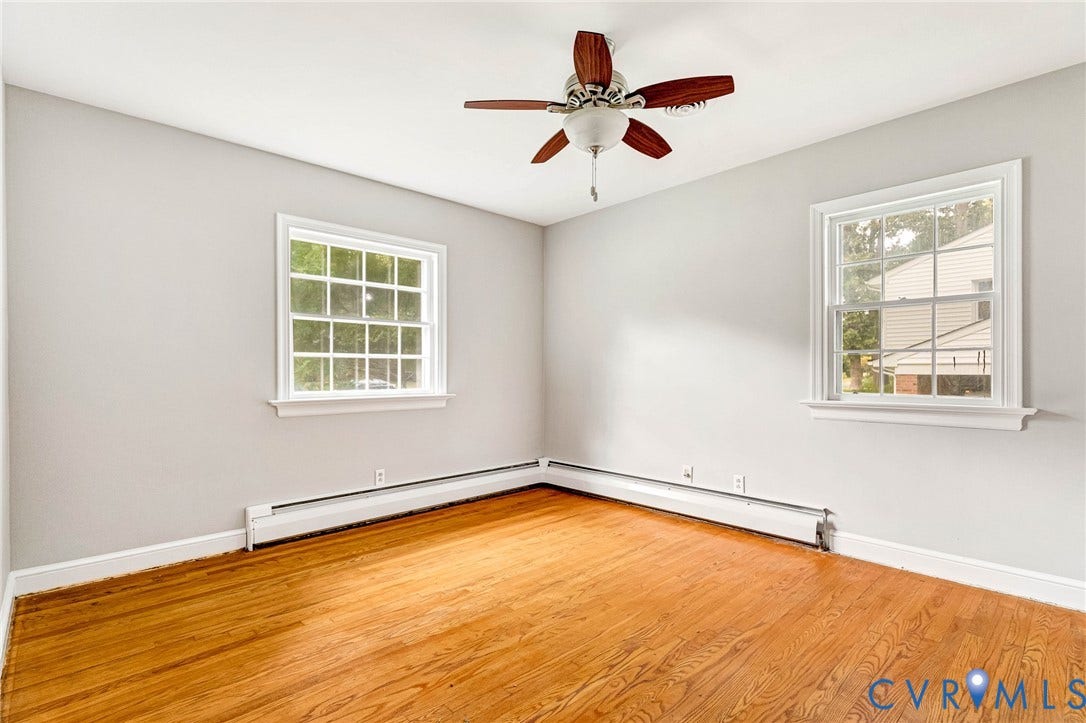 5215 Sprucewood Avenue, North Chesterfield, VA 23234 Hardwood flooring, painted walls, two multi-pane windows, and a ceiling fan with light fixture