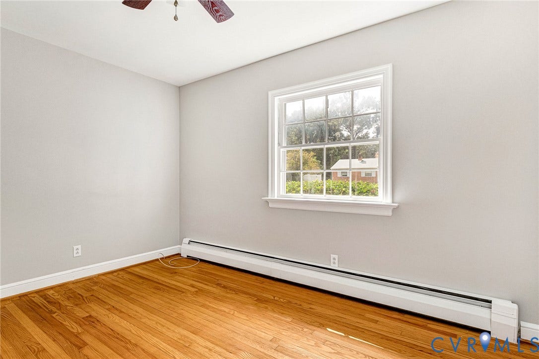 5215 Sprucewood Avenue, North Chesterfield, VA 23234 Hardwood flooring, painted walls, white trim, and a ceiling fan