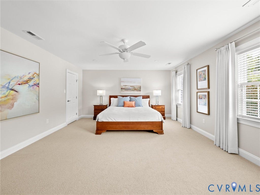 Recessed lighting, ceiling fan, neutral wall tones, large windows, and carpeted flooring