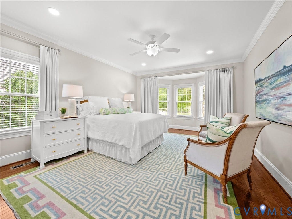 Hardwood flooring, recessed lighting, and crown molding