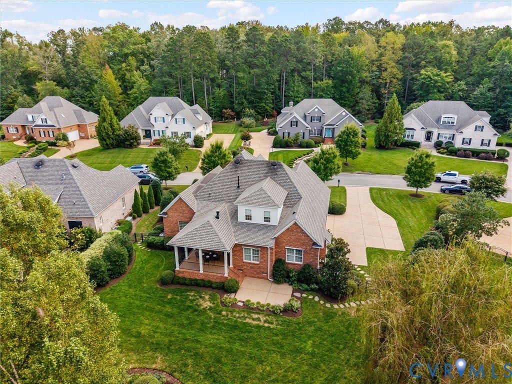 Brick exterior with a covered front porch and concrete patio