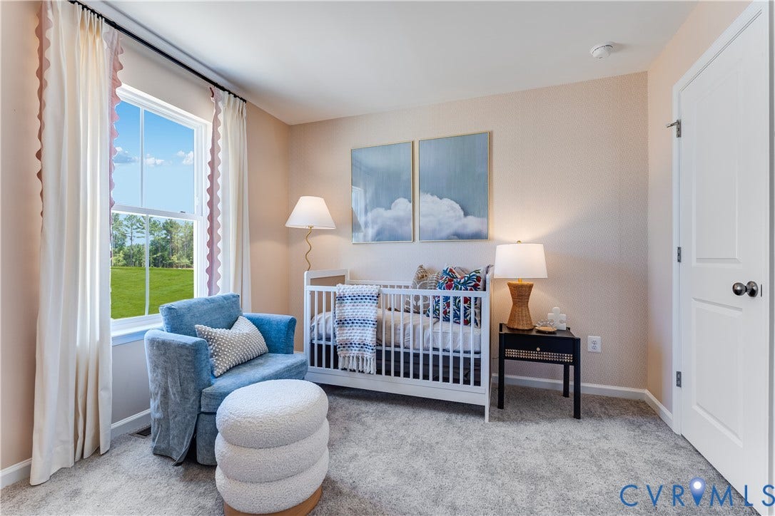 8708 Pullman Lane, Chesterfield, VA 23832 Carpeted room with a double-hung window, light-toned walls, and a white paneled door