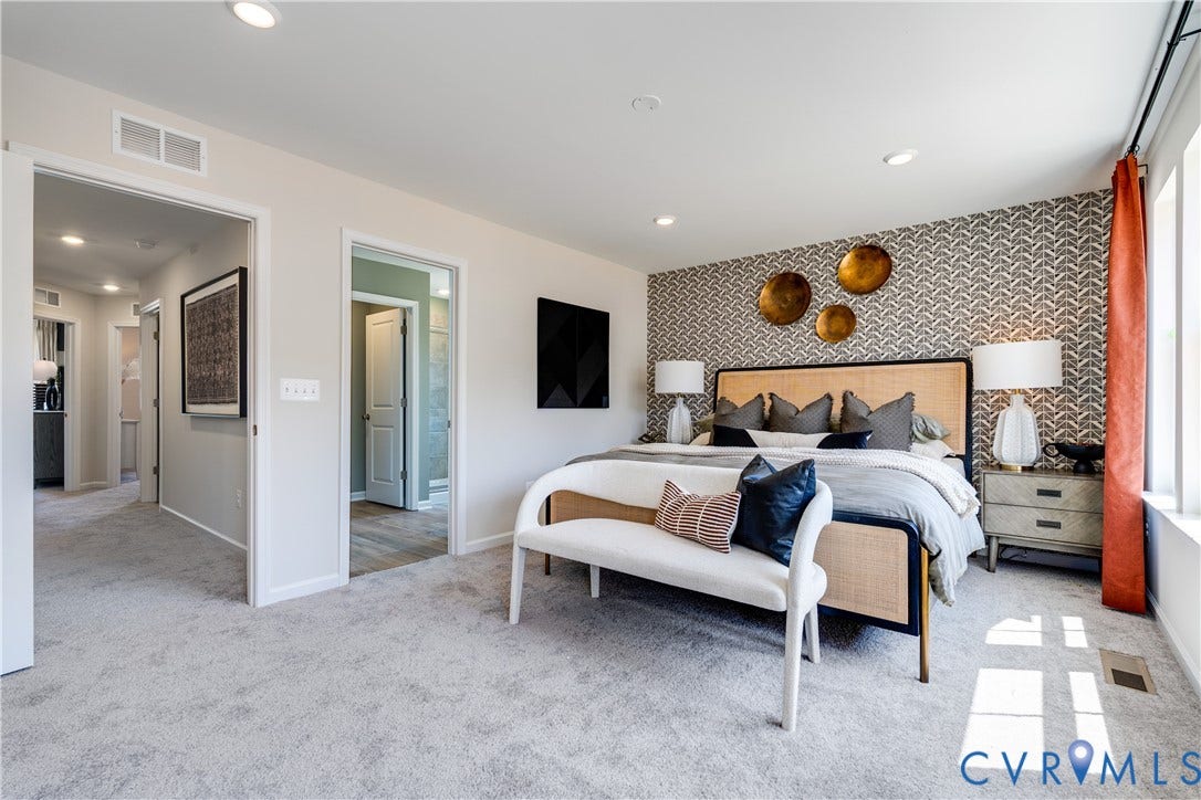 8708 Pullman Lane, Chesterfield, VA 23832 Wall-to-wall carpeting, recessed ceiling lighting, a patterned accent wall, and a large window with a curtain rod