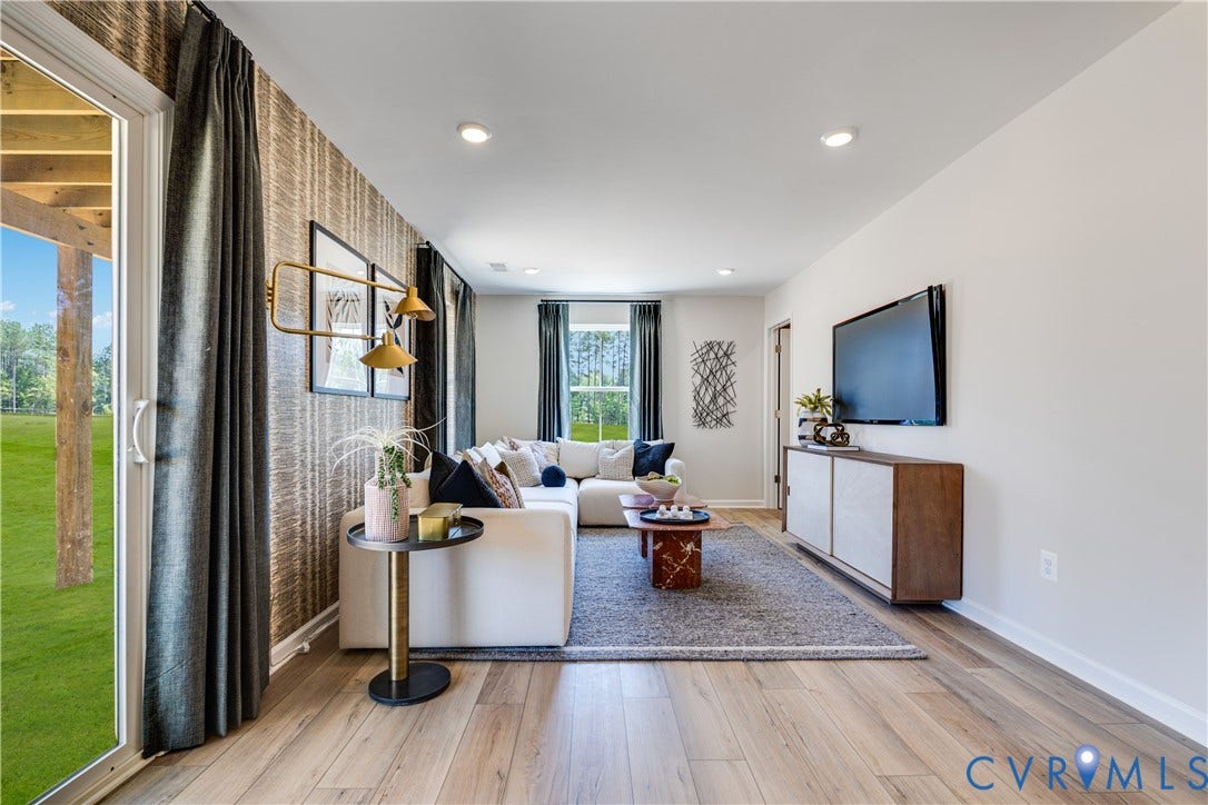 8708 Pullman Lane, Chesterfield, VA 23832 Recessed lighting illuminates the open-concept living space with wood-finish flooring