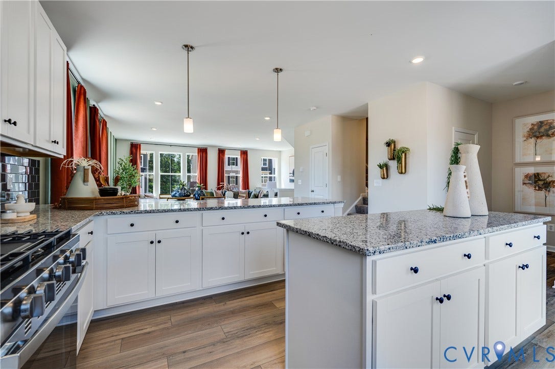 8708 Pullman Lane, Chesterfield, VA 23832 Kitchen featuring white cabinetry, light-toned countertops, a stainless steel range, and wood-finish flooring